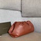 Bottega Veneta The Pouch Clutch In Rust Calfskin