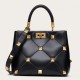 Valentino Roman Stud Top Handle Bag In Black Nappa